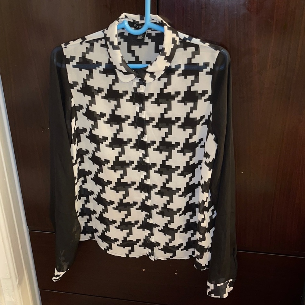Forever 21 geometrical design with black long sleeves ,Size medium.